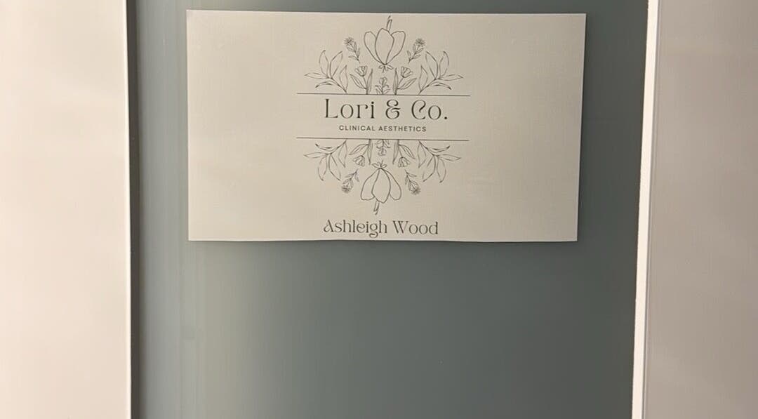 Elegant sign for Lori & Co. Clinical Aesthetics in Melbourne, Victoria, AU featuring decorative floral design.