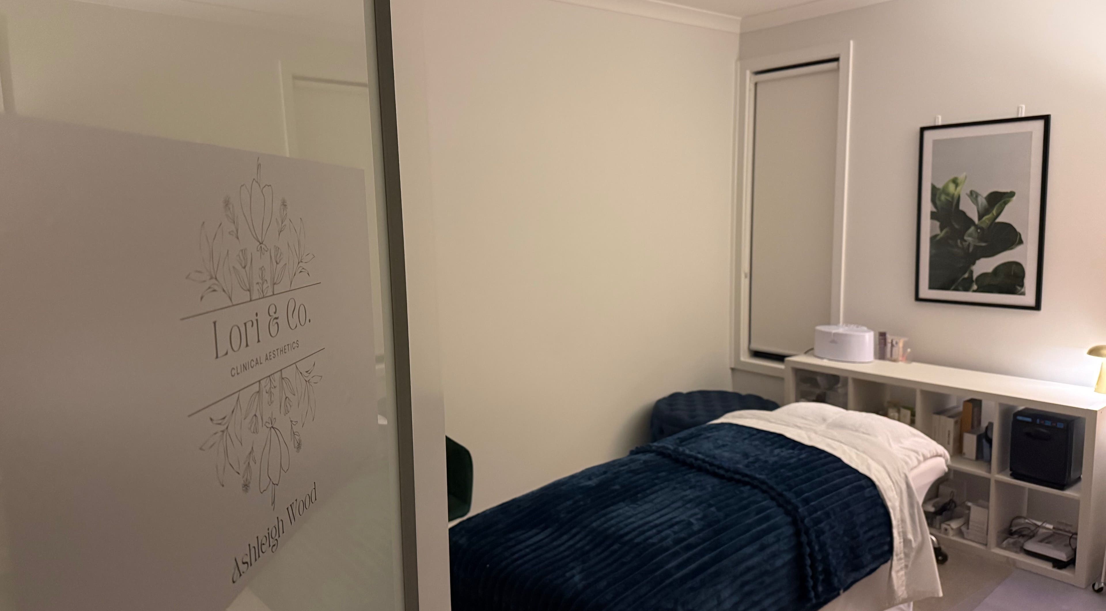 Serene treatment room at Lori & Co. Clinical Aesthetics, Melbourne, Victoria, AU featuring a cozy massage table.