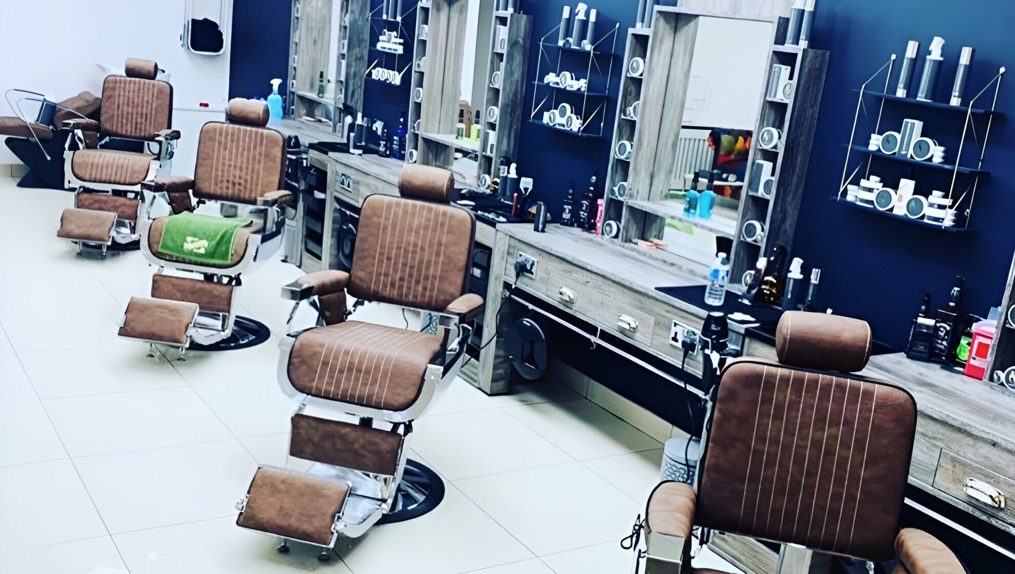Interior of Le Vogue Barber in Bowdon, England, GB, showcasing sleek, vintage-style barber chairs.