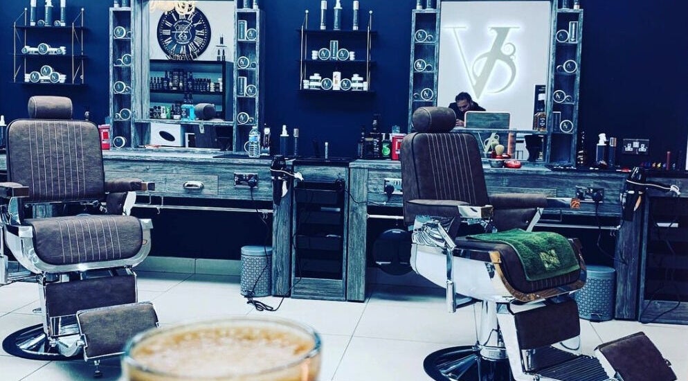 Elegant interior of Le Vogue Barber in Bowdon, England, GB featuring stylish barber chairs and decor.