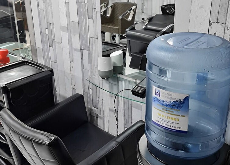 Modern salon corner with seating at Adiscolocstylist, Peckham, United Kingdom, GB.