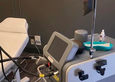 Modern treatment room at Elegance Cosmetic, Markham, Ontario, CA with advanced equipment and comfortable chair.