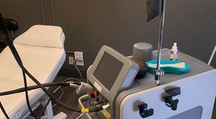 Modern treatment room at Elegance Cosmetic, Markham, Ontario, CA with advanced equipment and comfortable chair.