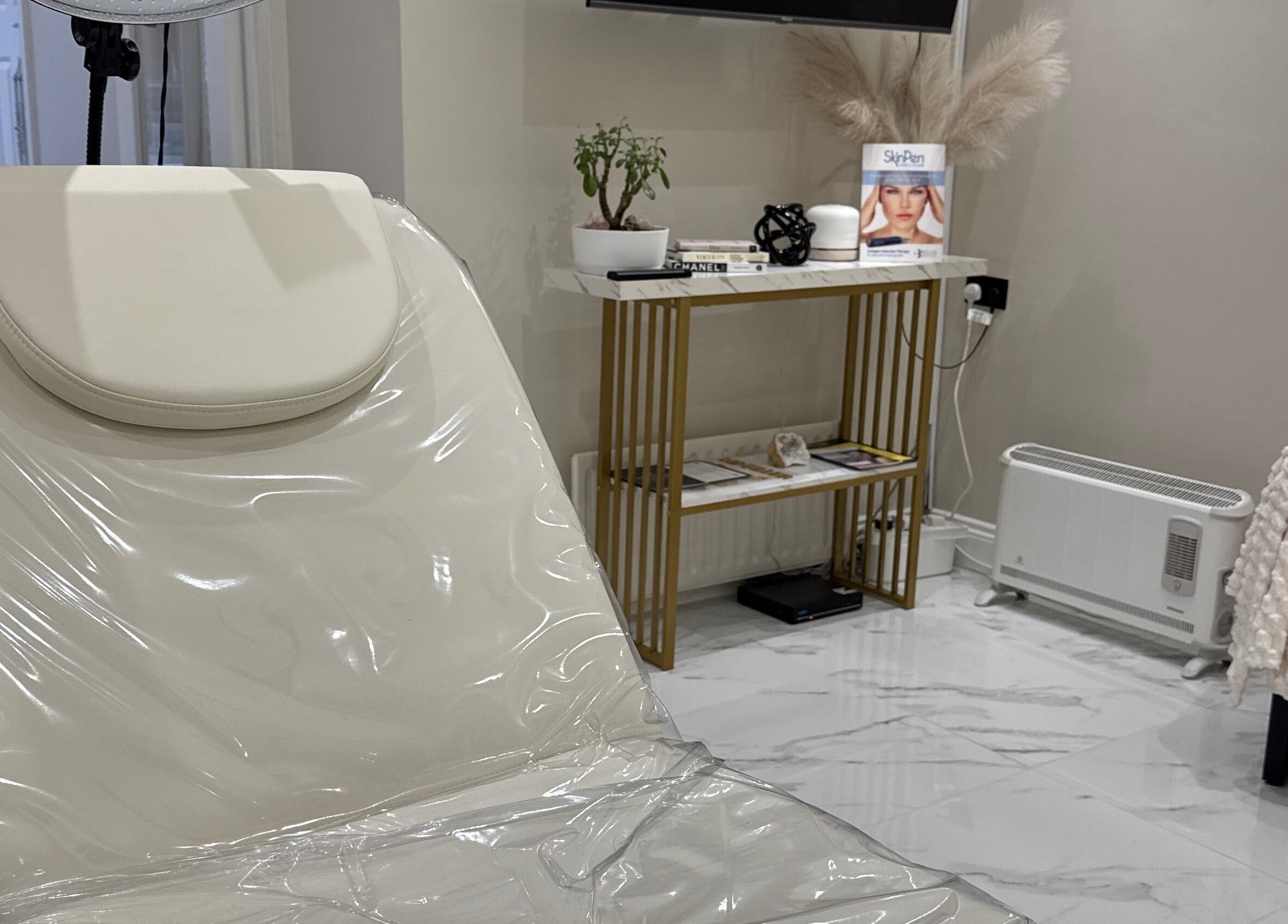 Relaxing treatment room at Mood Skin and Aesthetics in London, England, GB showcasing a serene, elegant design.