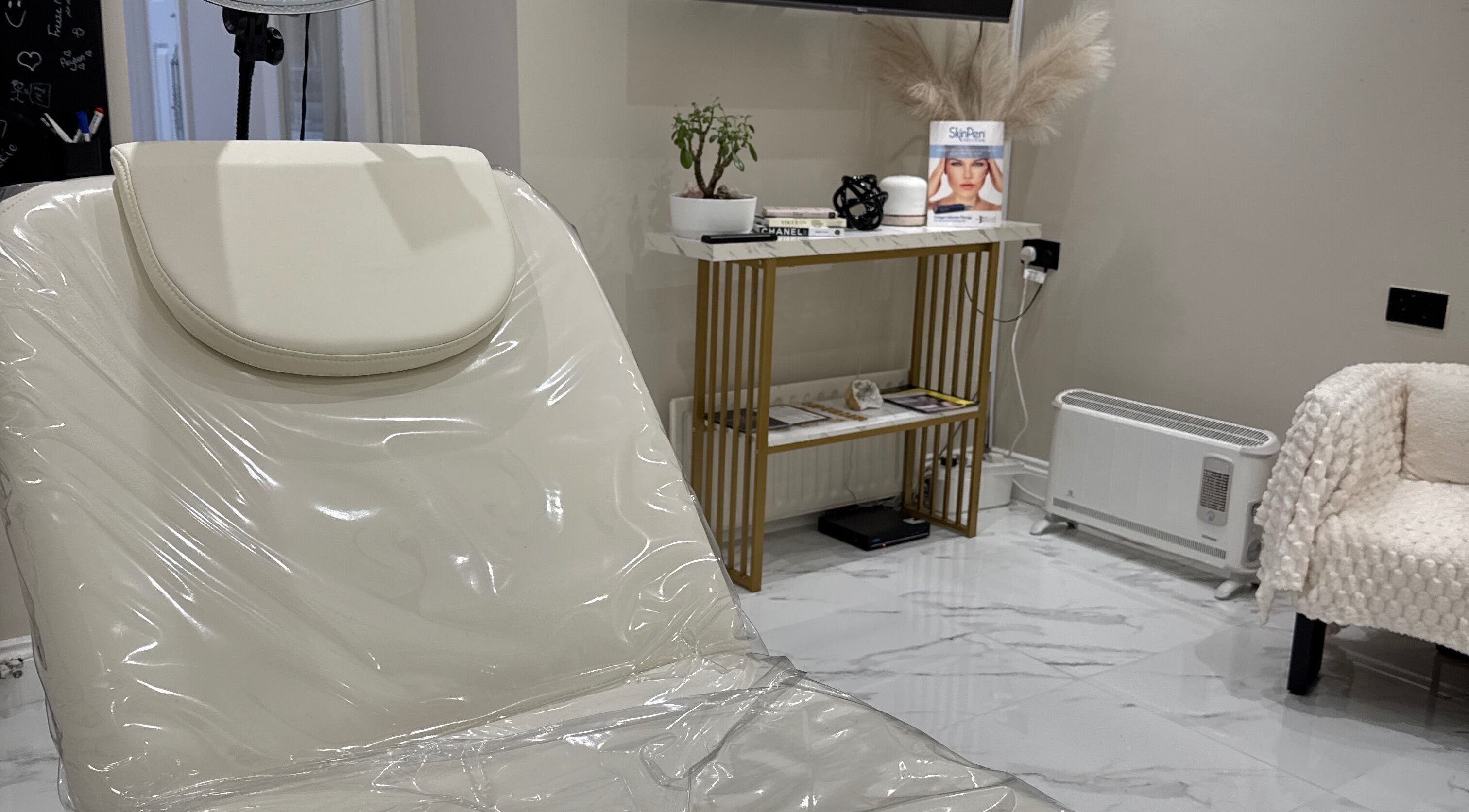 Relaxing treatment room at Mood Skin and Aesthetics in London, England, GB showcasing a serene, elegant design.