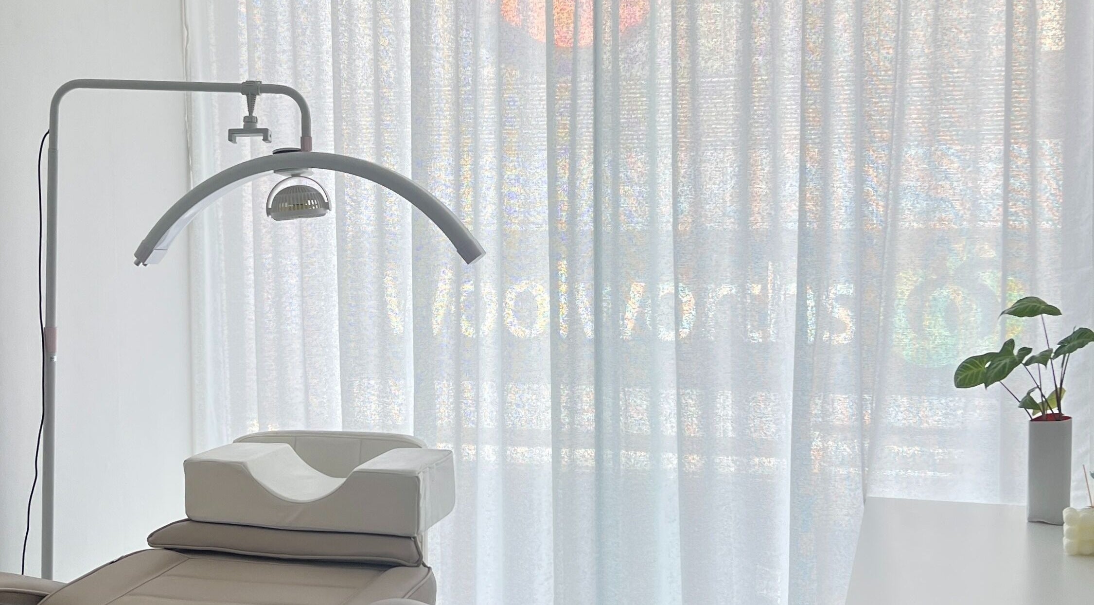 Relaxing treatment room at Yume Aesthetics, Burwood, New South Wales, AU, featuring a comfortable chair and soft lighting.