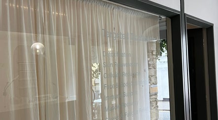 View of serene wellness area at Saunapod, featuring soft curtains in Falmouth, England, GB.