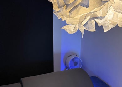 SAUNAPOD in Falmouth, England, GB features a serene room with artistic lighting and calming atmosphere.