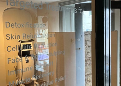 Treatment room at SAUNAPOD in Falmouth, England highlighting modern wellness equipment.