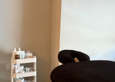 Relaxing massage table and skincare products at Saunapod, Falmouth, England, GB.