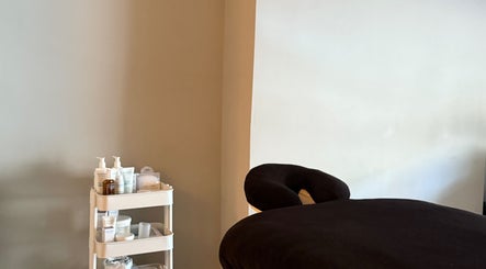 Relaxing massage table and skincare products at Saunapod, Falmouth, England, GB.