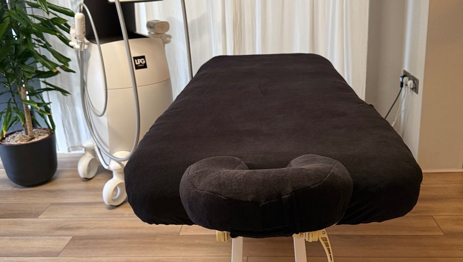 Luxurious massage table at Saunapod, Falmouth, England, GB, ready for relaxation therapy.
