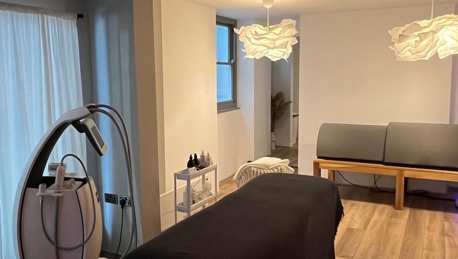 Relaxing treatment room at Saunapod in Falmouth, England, GB, featuring modern decor and wellness equipment.