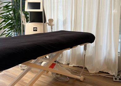 Relaxing treatment room at Saunapod, Falmouth, England, GB with modern equipment and ambient lighting.