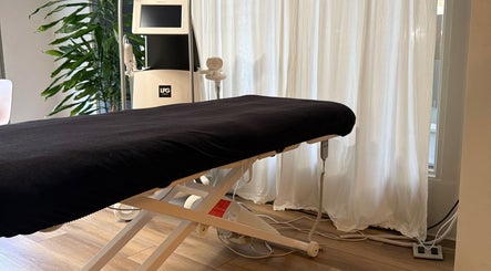 Relaxing treatment room at Saunapod, Falmouth, England, GB with modern equipment and ambient lighting.