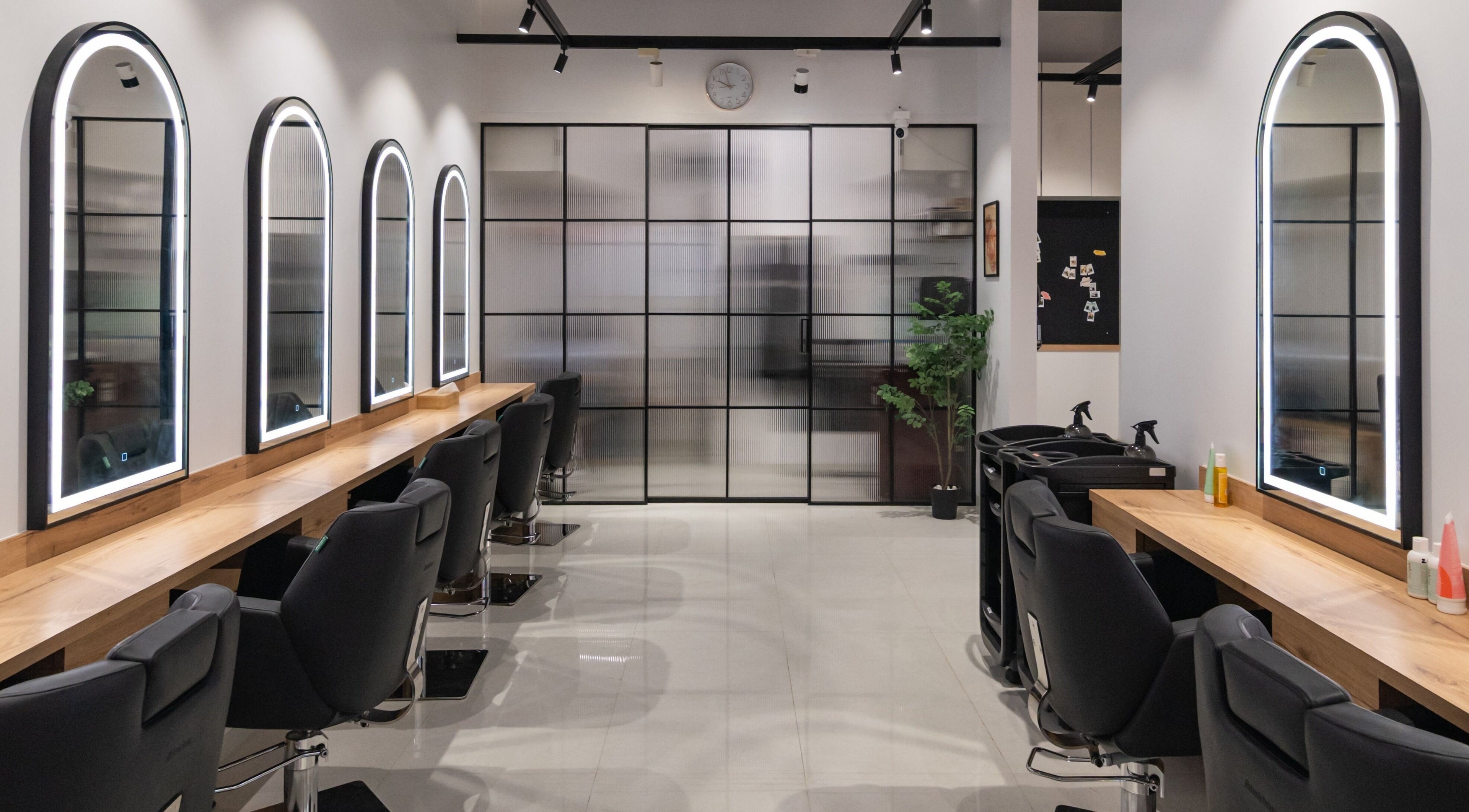 Chic salon interior with illuminated mirrors at Alchemic Beauty Studio Mumbai, Mumbai, Maharashtra, IN.