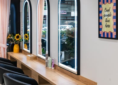 Elegant styling area at Alchemic Beauty Studio Mumbai with sunflowers and mirrors, Mumbai, Maharashtra, IN.