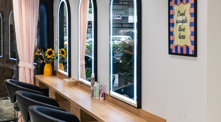 Elegant styling area at Alchemic Beauty Studio Mumbai with sunflowers and mirrors, Mumbai, Maharashtra, IN.