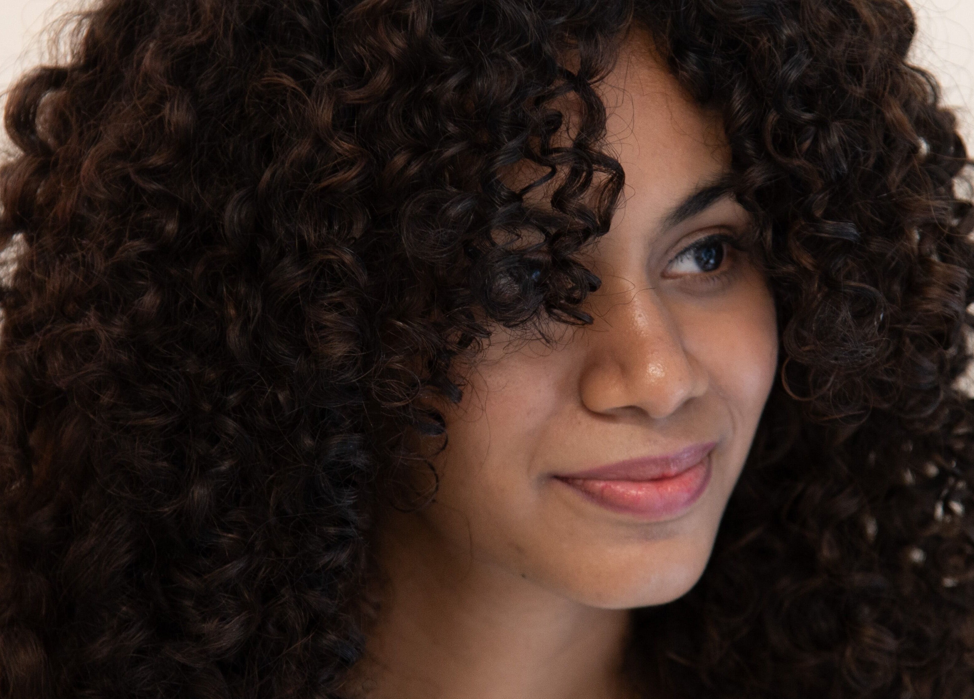 Close-up of woman with stylish curls at Alchemic Beauty Studio Chennai, Chennai, Tamil Nadu, IN.