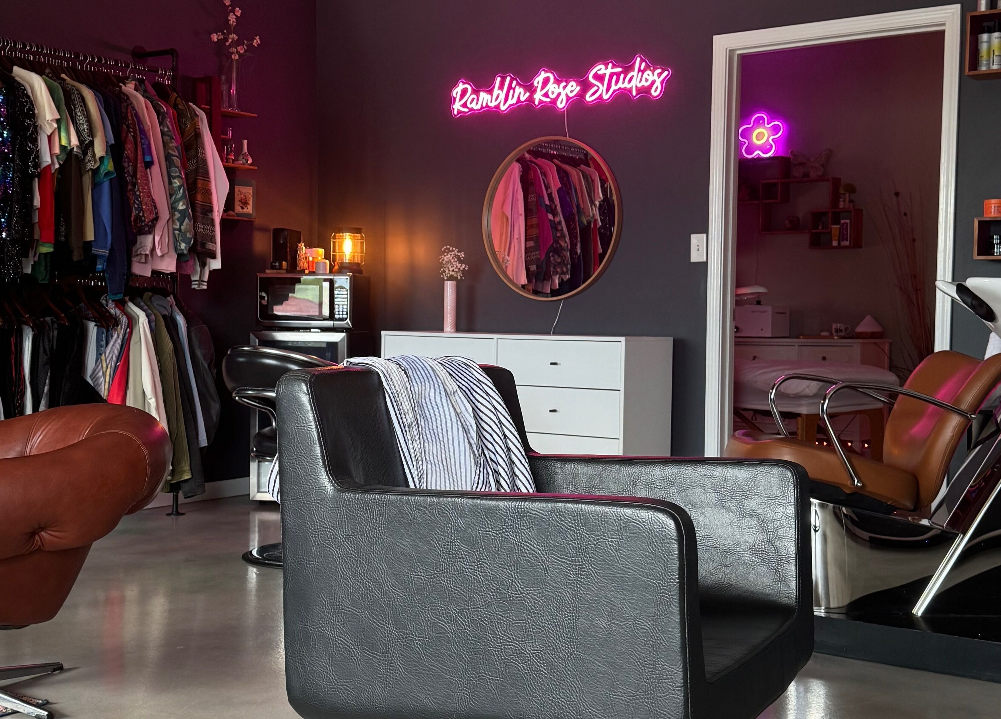 Stylish interior of Ramblin’ Rose Studios in Anderson, South Carolina, US featuring chic salon chairs and decor.