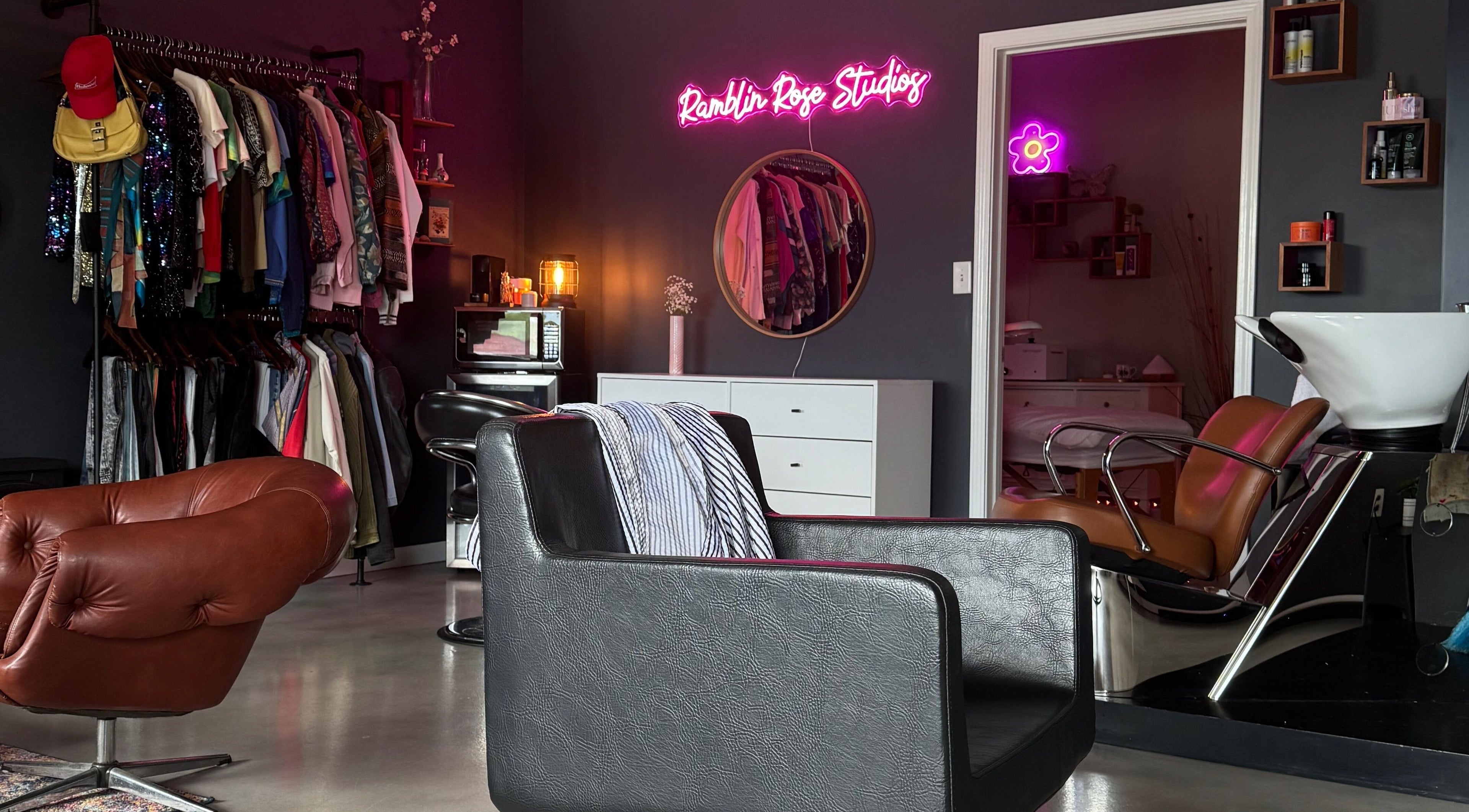 Stylish interior of Ramblin’ Rose Studios in Anderson, South Carolina, US featuring chic salon chairs and decor.