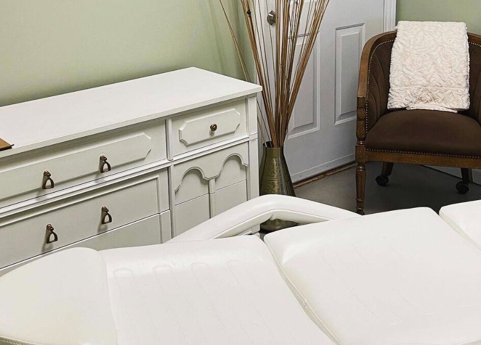 Cozy treatment room at Ramblin’ Rose Studios, Anderson, South Carolina, US, with relaxing decor.