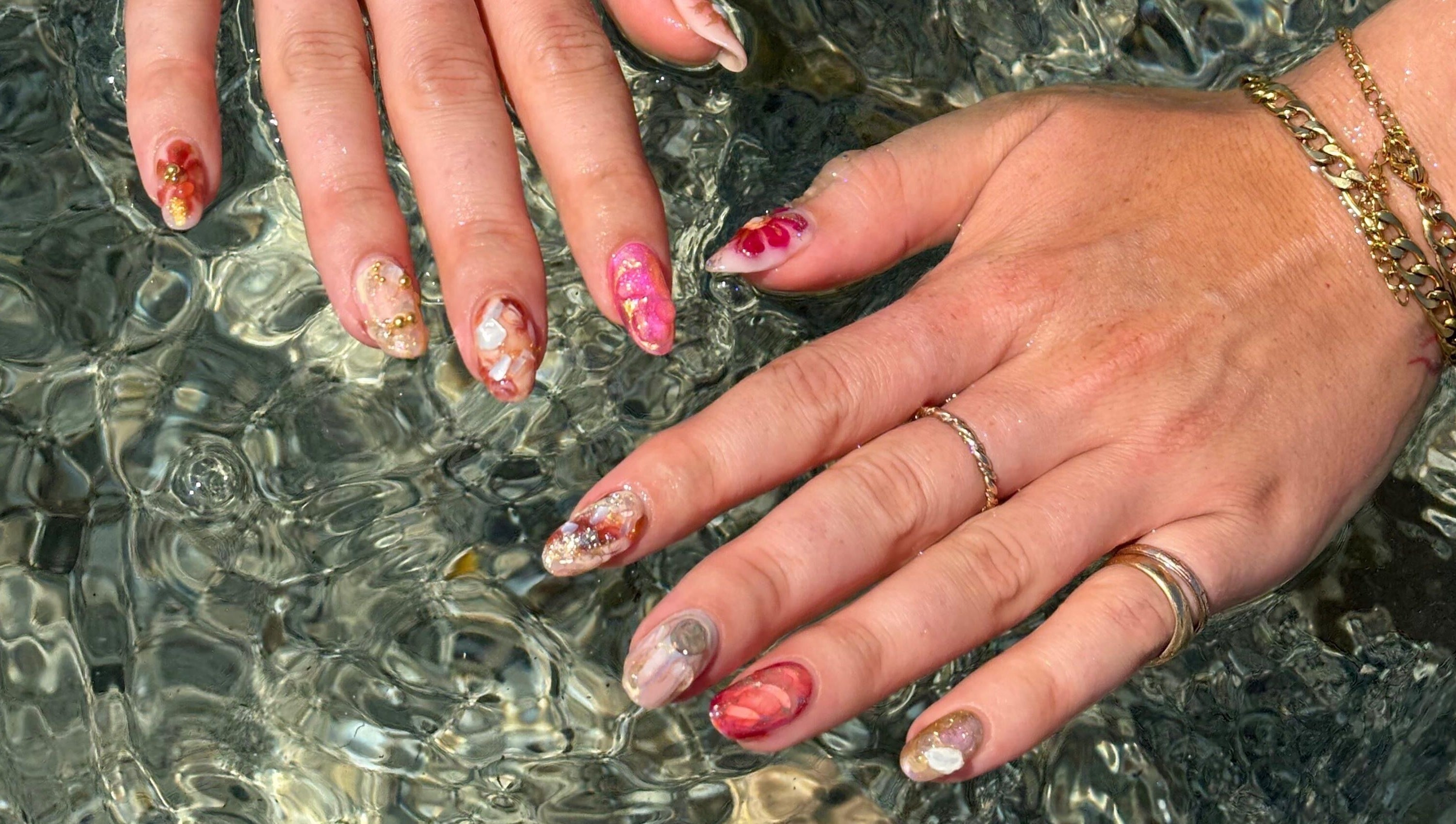 Colorful artistic manicure at Thrive Studio, London, England, GB, showcasing intricate nail designs.