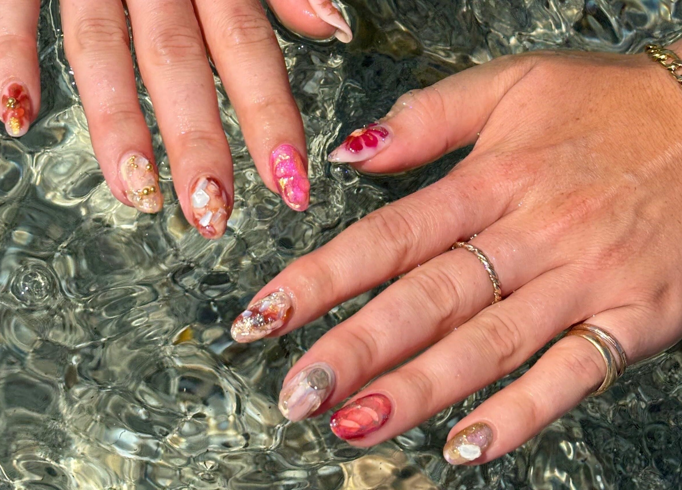 Colorful artistic manicure at Thrive Studio, London, England, GB, showcasing intricate nail designs.