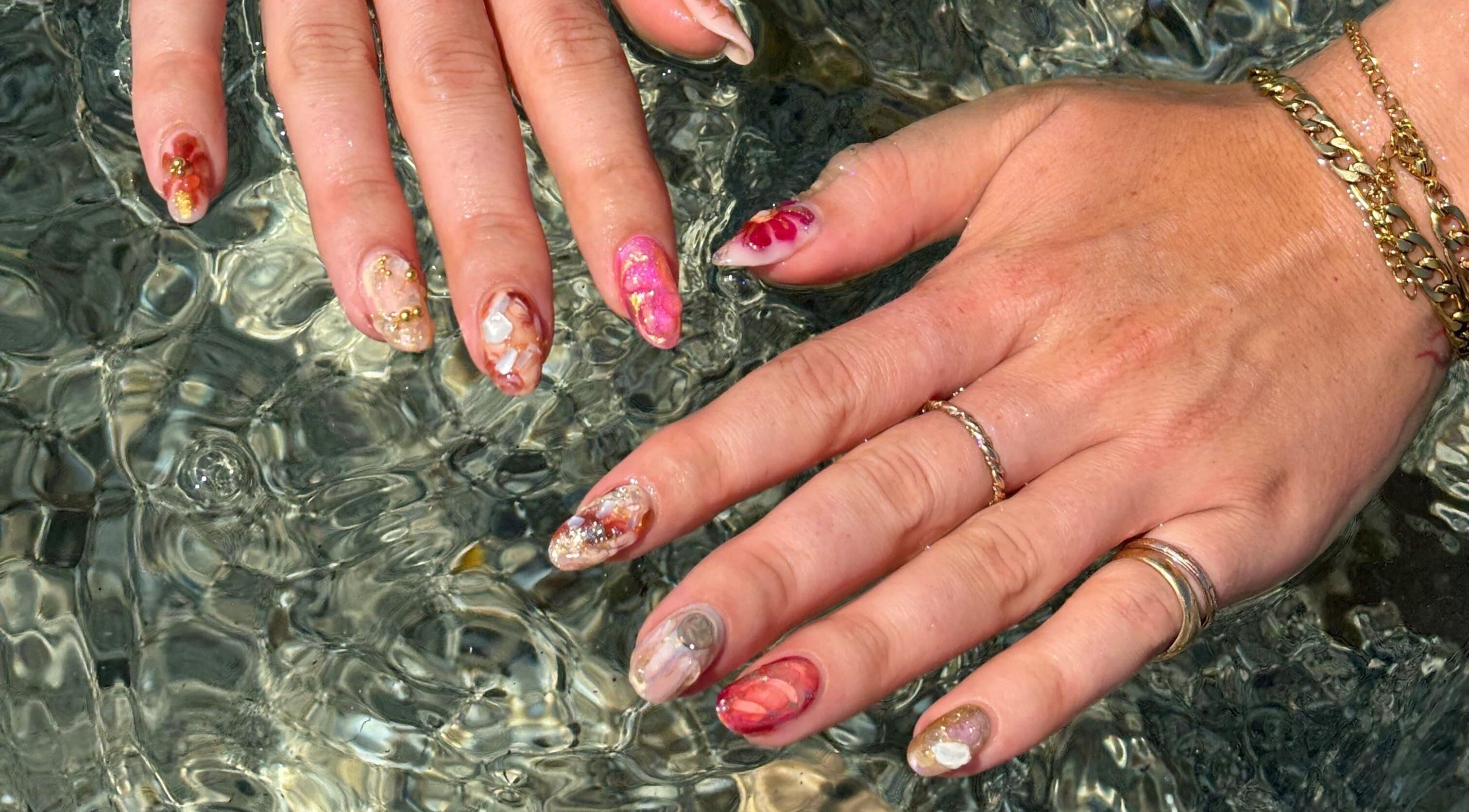 Colorful artistic manicure at Thrive Studio, London, England, GB, showcasing intricate nail designs.
