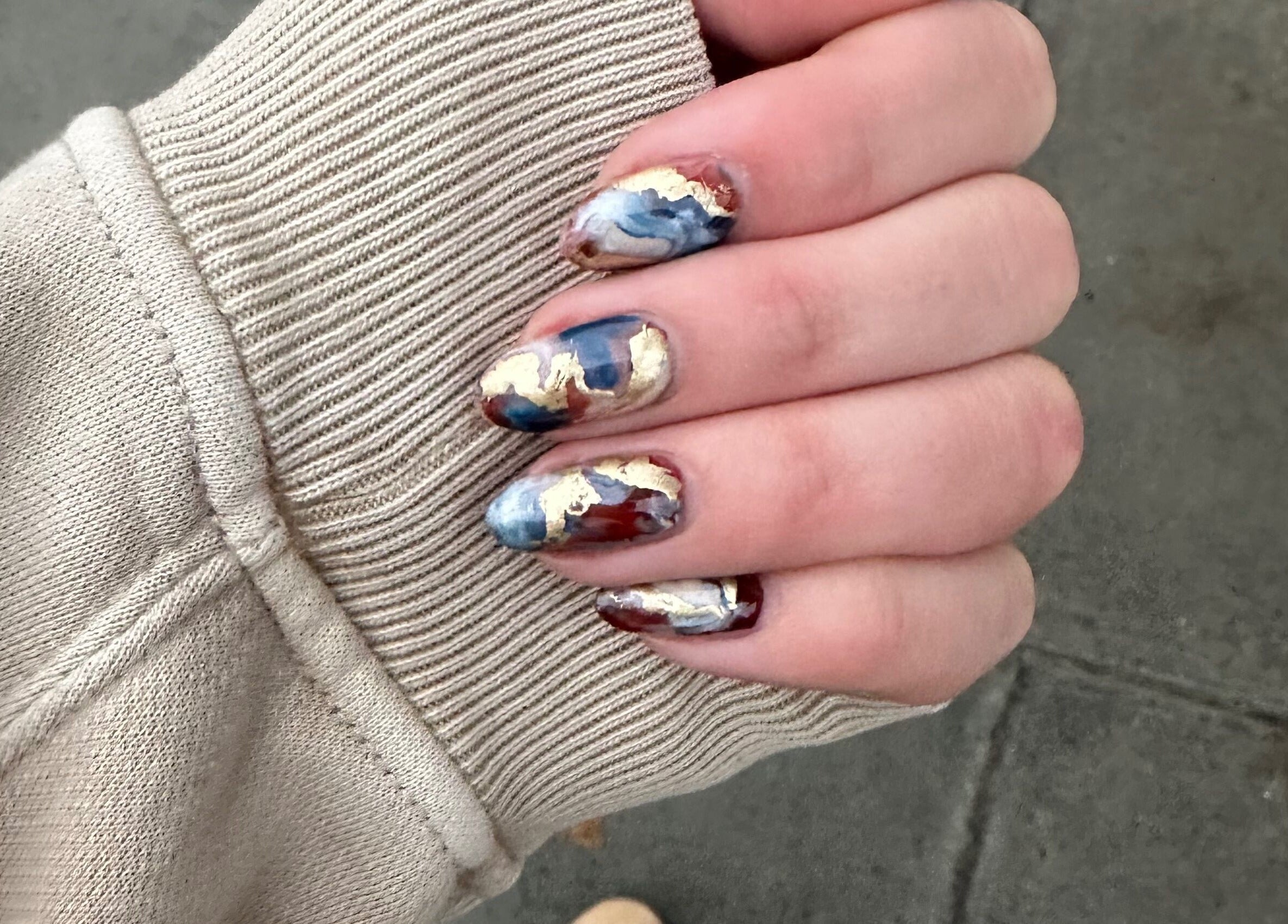 Elegant marble nail art design showcased at Thrive Studio, London, England, GB.