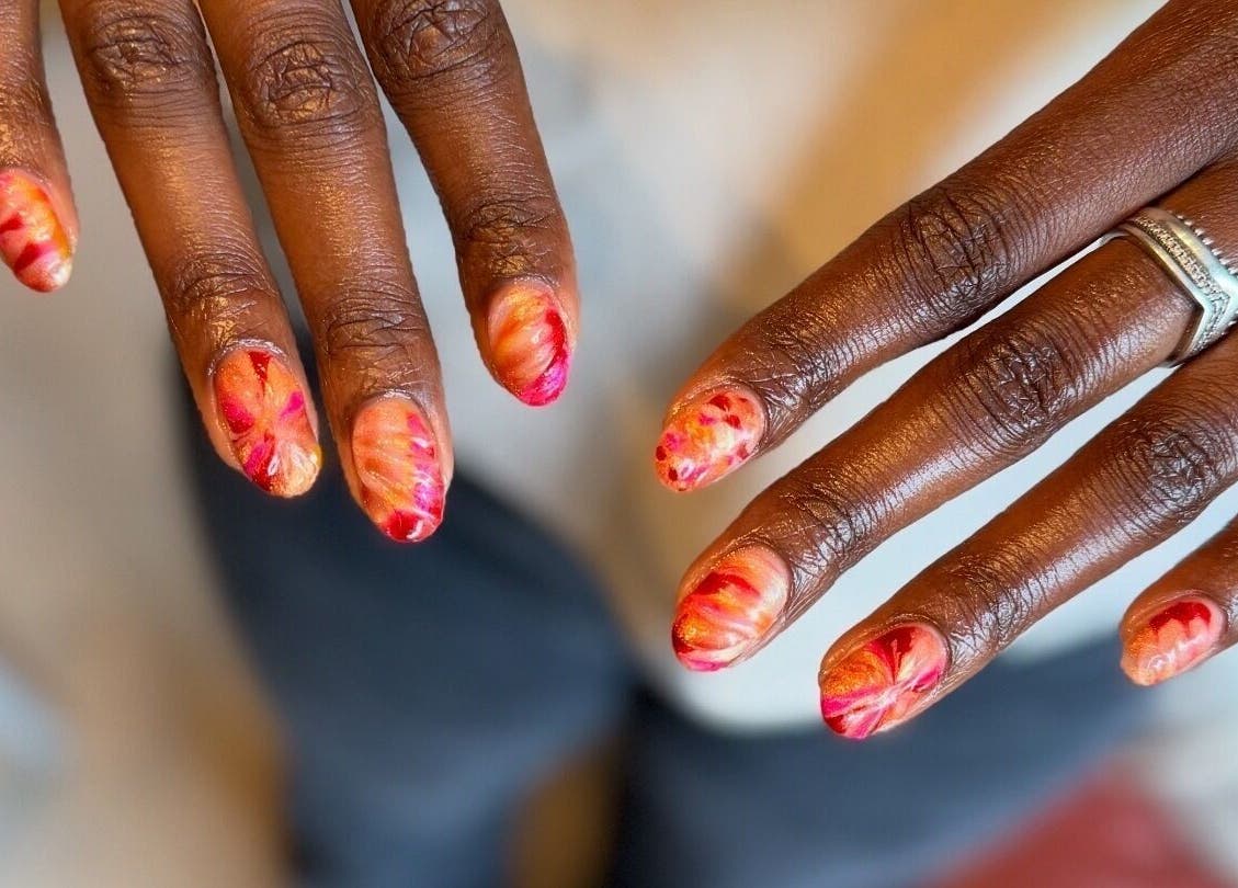 Colorful manicure at Thrive Studio, London, England, GB, showcasing intricate nail art designs.