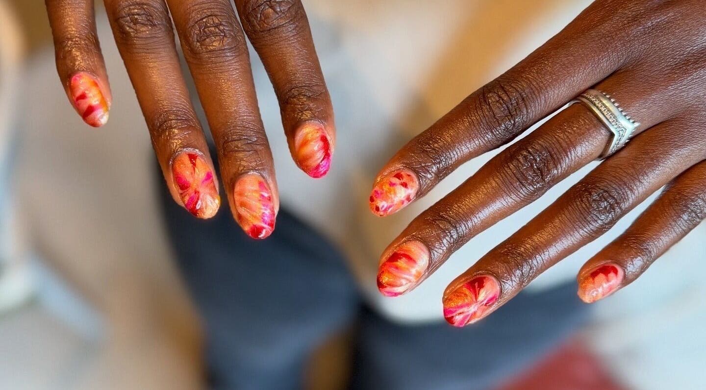 Colorful manicure at Thrive Studio, London, England, GB, showcasing intricate nail art designs.