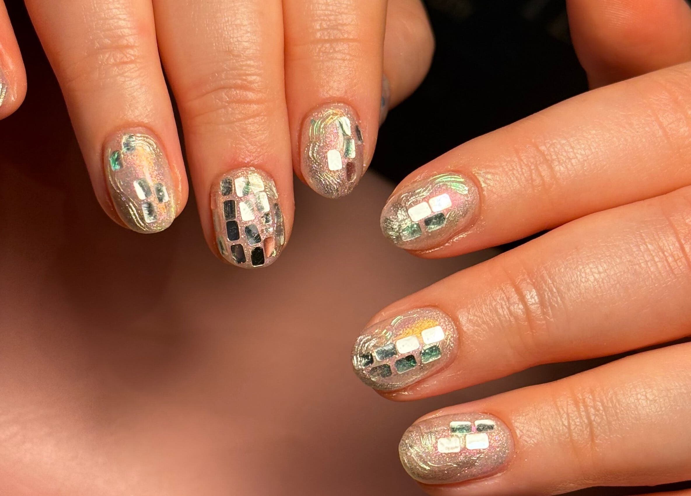 Shimmering mosaic nail art at Thrive Studio, London, England, GB. Perfect for a chic, modern look.