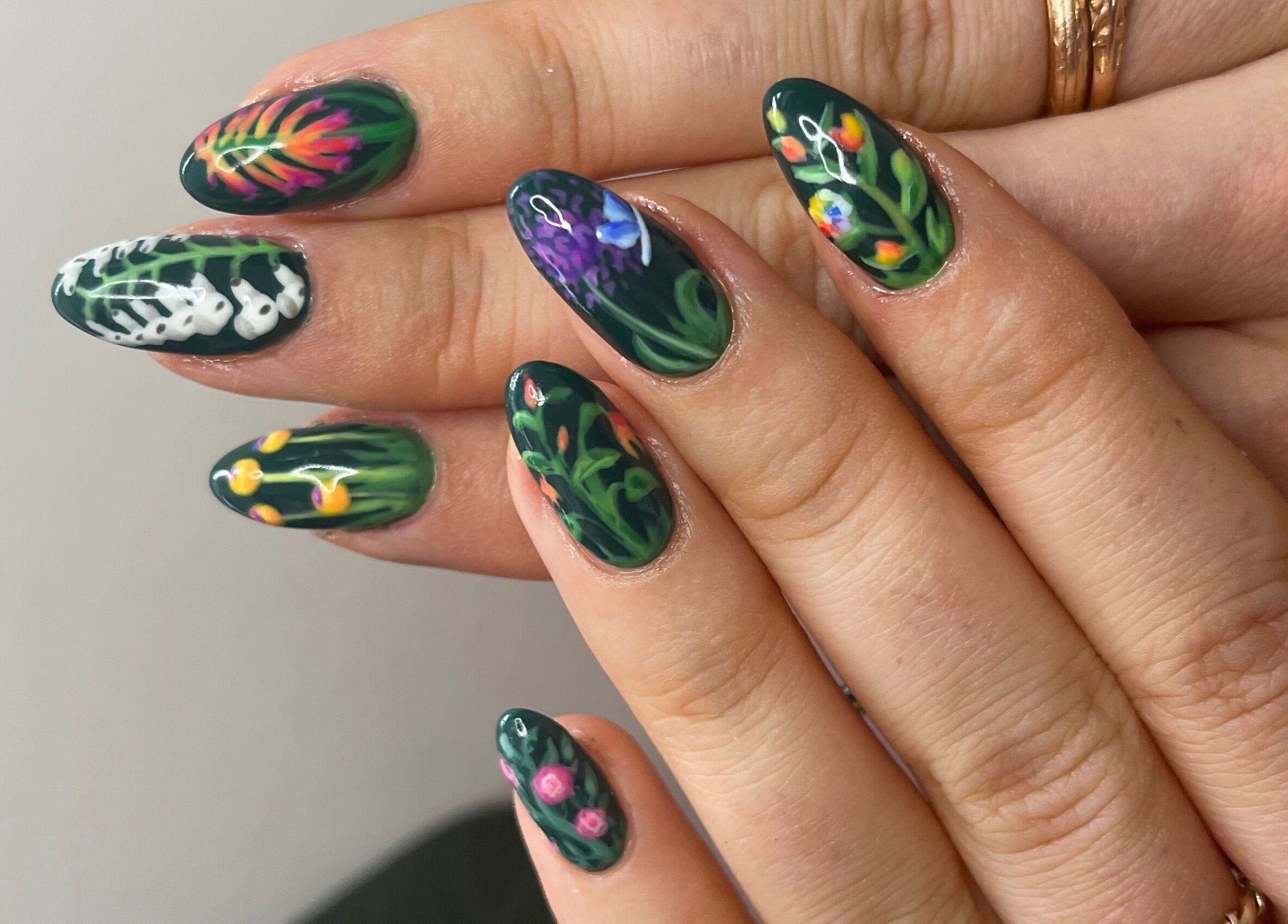 Intricate floral nail art at Thrive Studio in London, England, GB, showcasing elegant botanical designs.