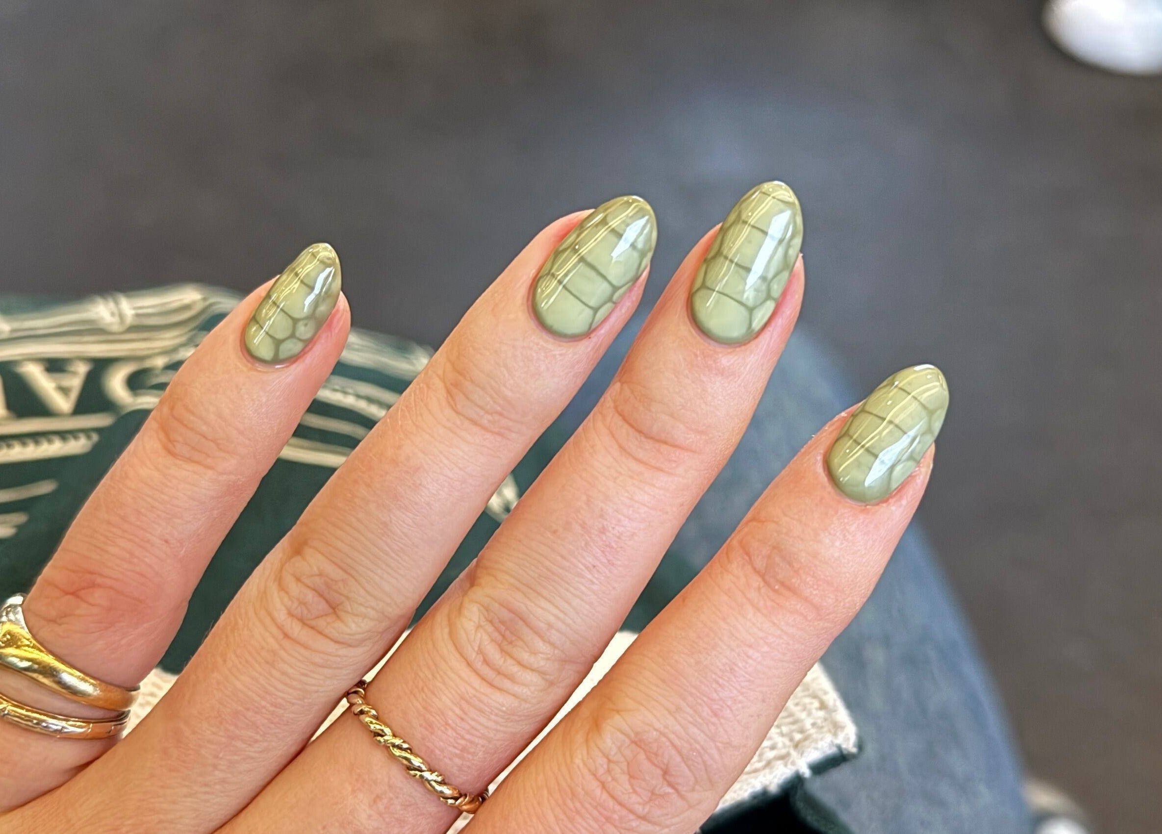 Exquisite green nail art design at Thrive Studio, London, England, GB showcasing elegance and style.