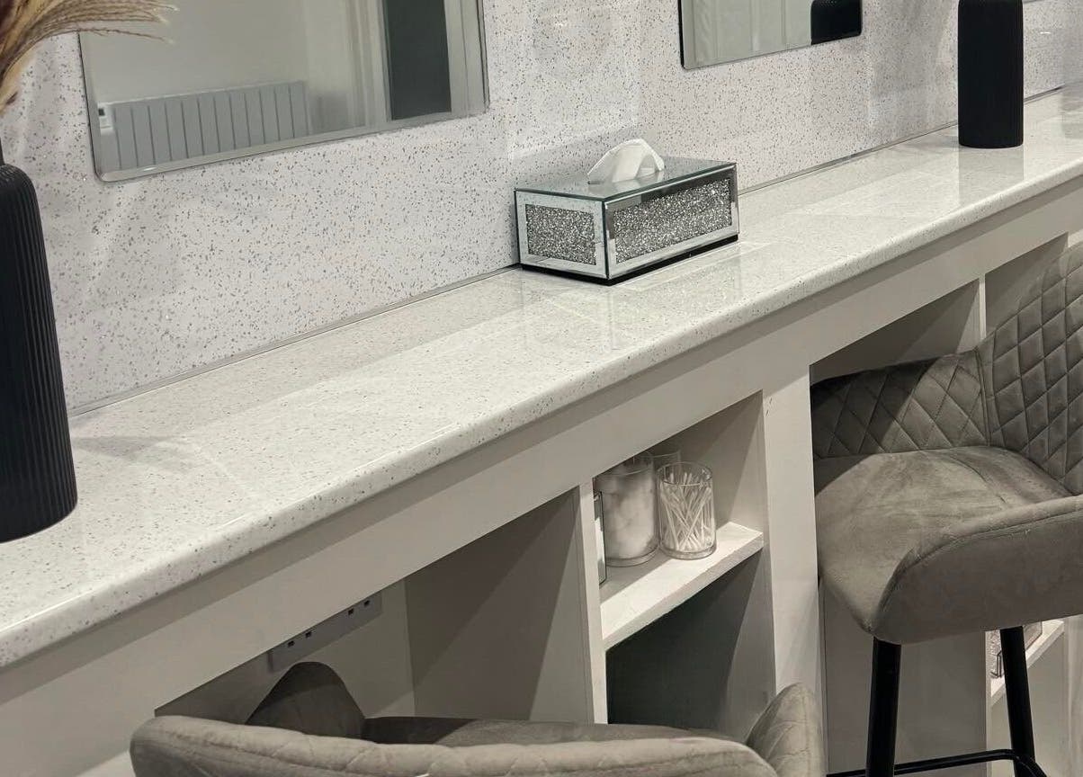 Elegant beauty station at Elysium Beauty Limited, Castletown GB, featuring stylish decor and plush seating.