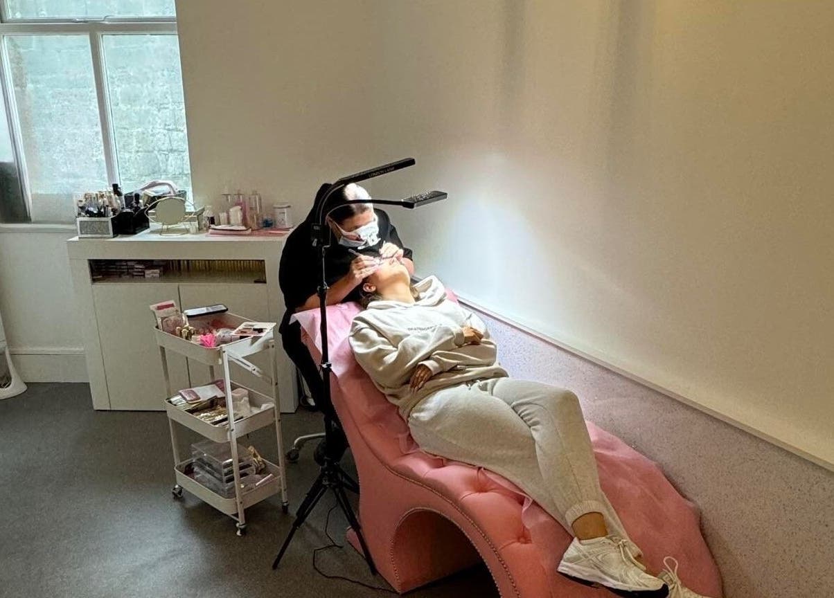 Cozy treatment room at Elysium Beauty Limited, Castletown, GB, featuring a relaxing pink chair for beauty services.