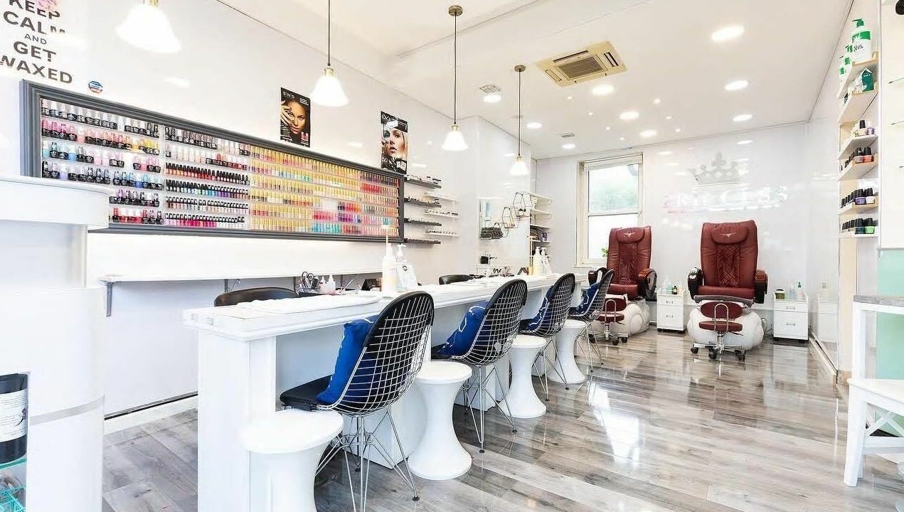 Elegant interior of Princess Nails and Beauty in London, England, GB with modern nail stations and product displays.