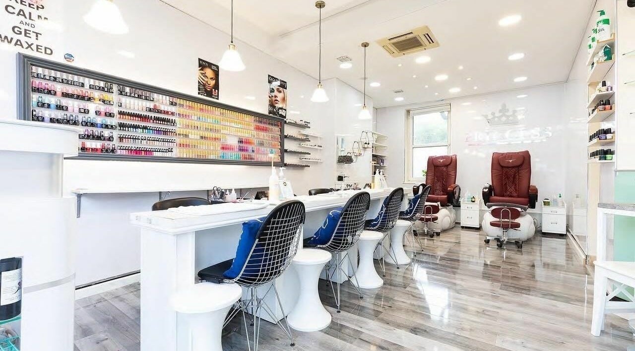 Elegant interior of Princess Nails and Beauty in London, England, GB with modern nail stations and product displays.