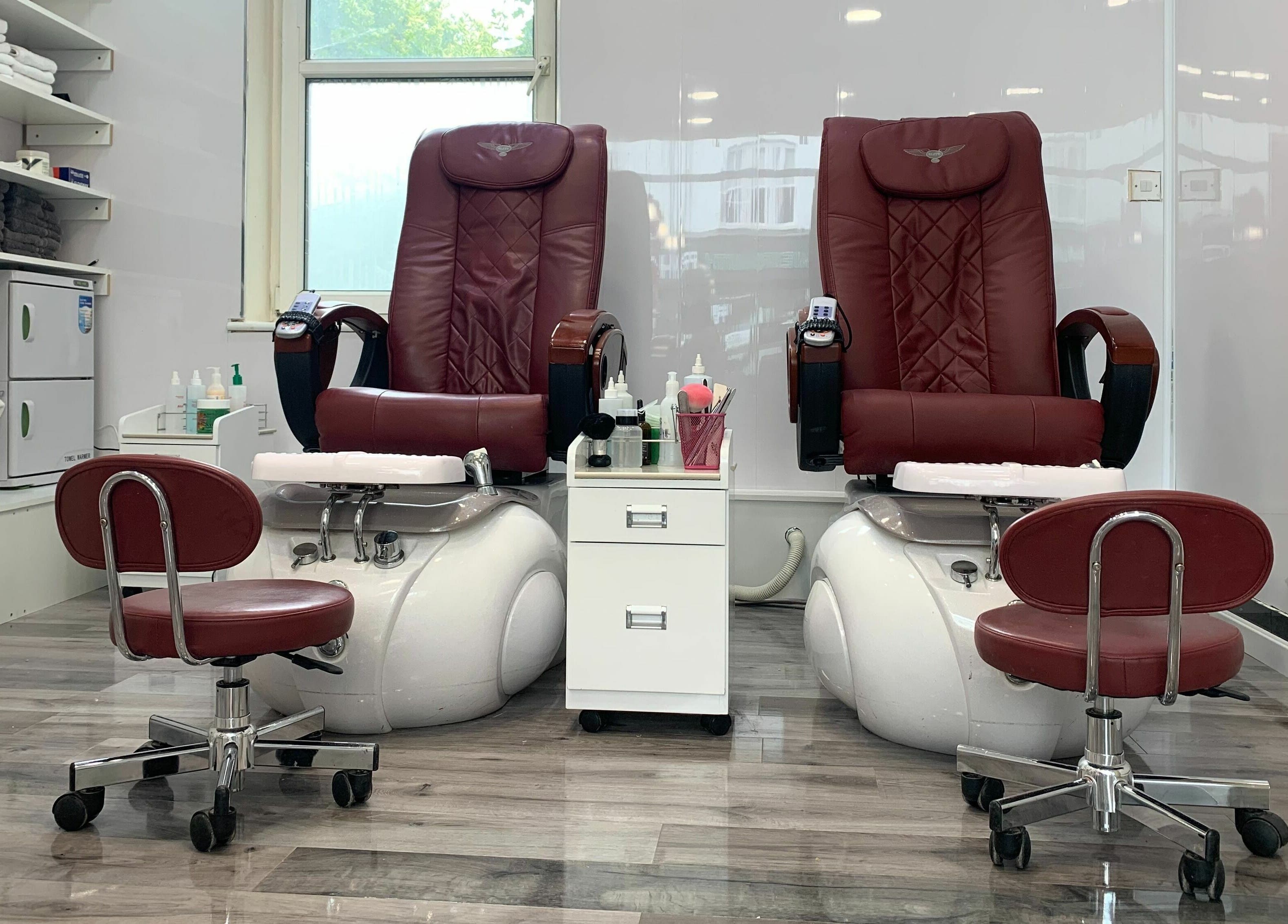 Elegant red pedicure chairs at Princess Nails and Beauty in London, England, GB, offering a relaxing experience.