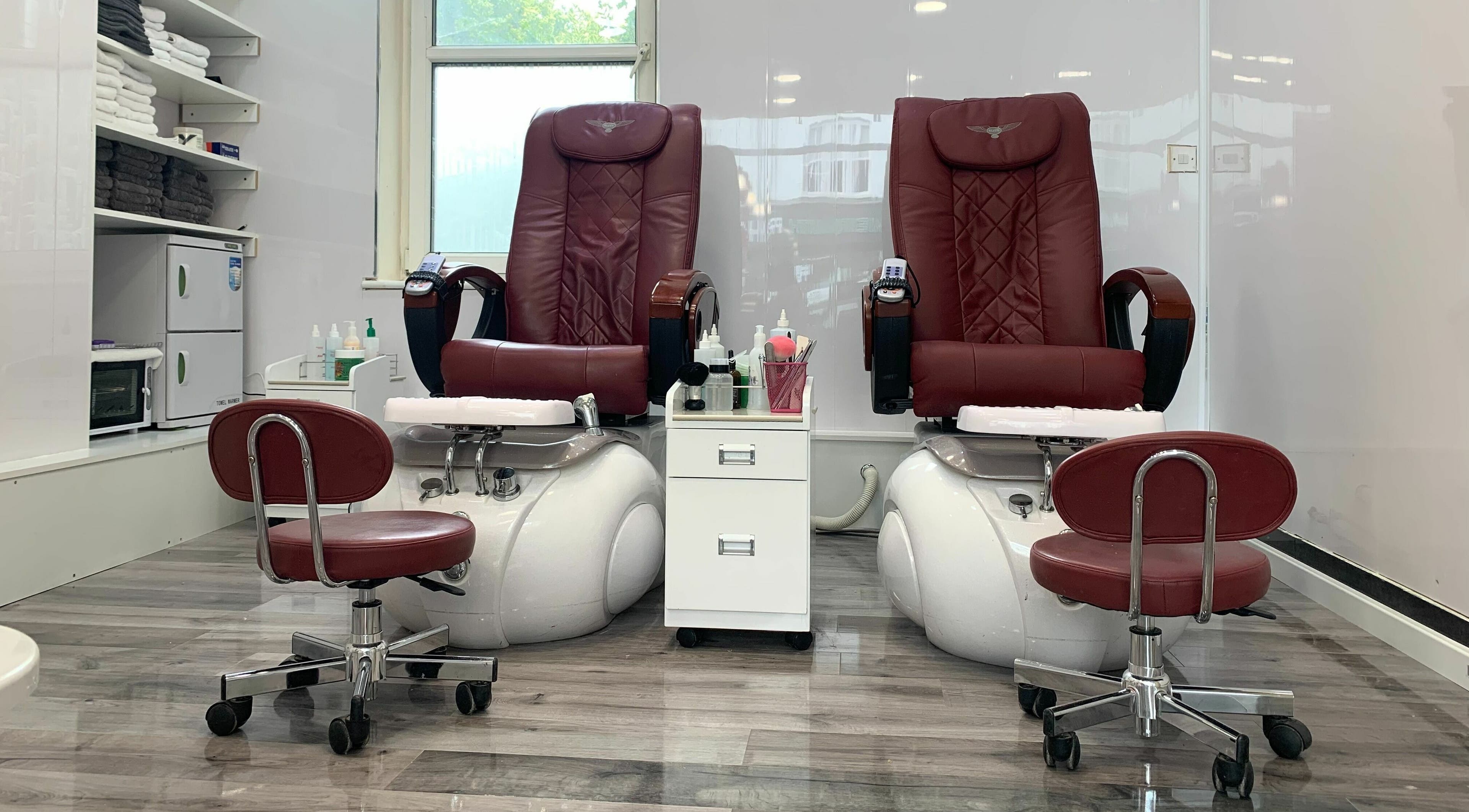 Elegant red pedicure chairs at Princess Nails and Beauty in London, England, GB, offering a relaxing experience.