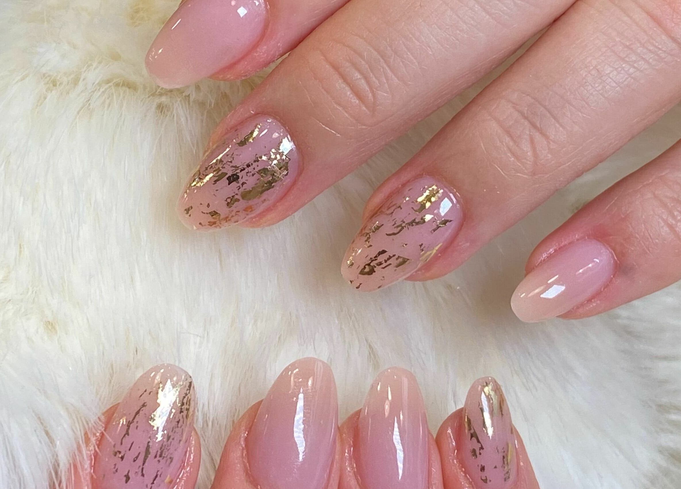 Elegant pink nail art with gold foil at Princess Nails and Beauty, London, England, GB.
