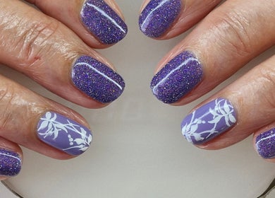 Elegant purple nails with floral art by Nails by Kelly, Waipu, Northland, NZ.