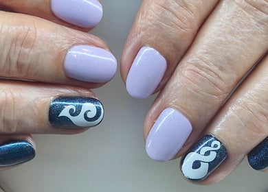 Elegant nail art at Nails by Kelly, Waipu, Northland, NZ featuring light purple and intricate dark designs.