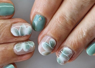 Elegant floral nail art with jewels at Nails by Kelly, Waipu, Northland, NZ, showcasing intricate designs.