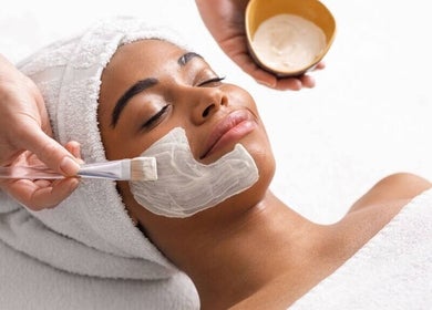Relaxing facial treatment at Veiled Beauty Bar, Woodridge, Queensland, AU. Client enjoying a soothing face mask.