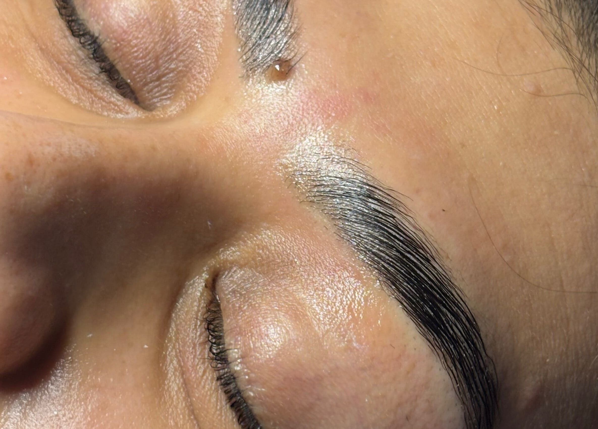 Close-up of expertly shaped eyebrows at Veiled Beauty Bar in Browns Plains, Queensland, AU.