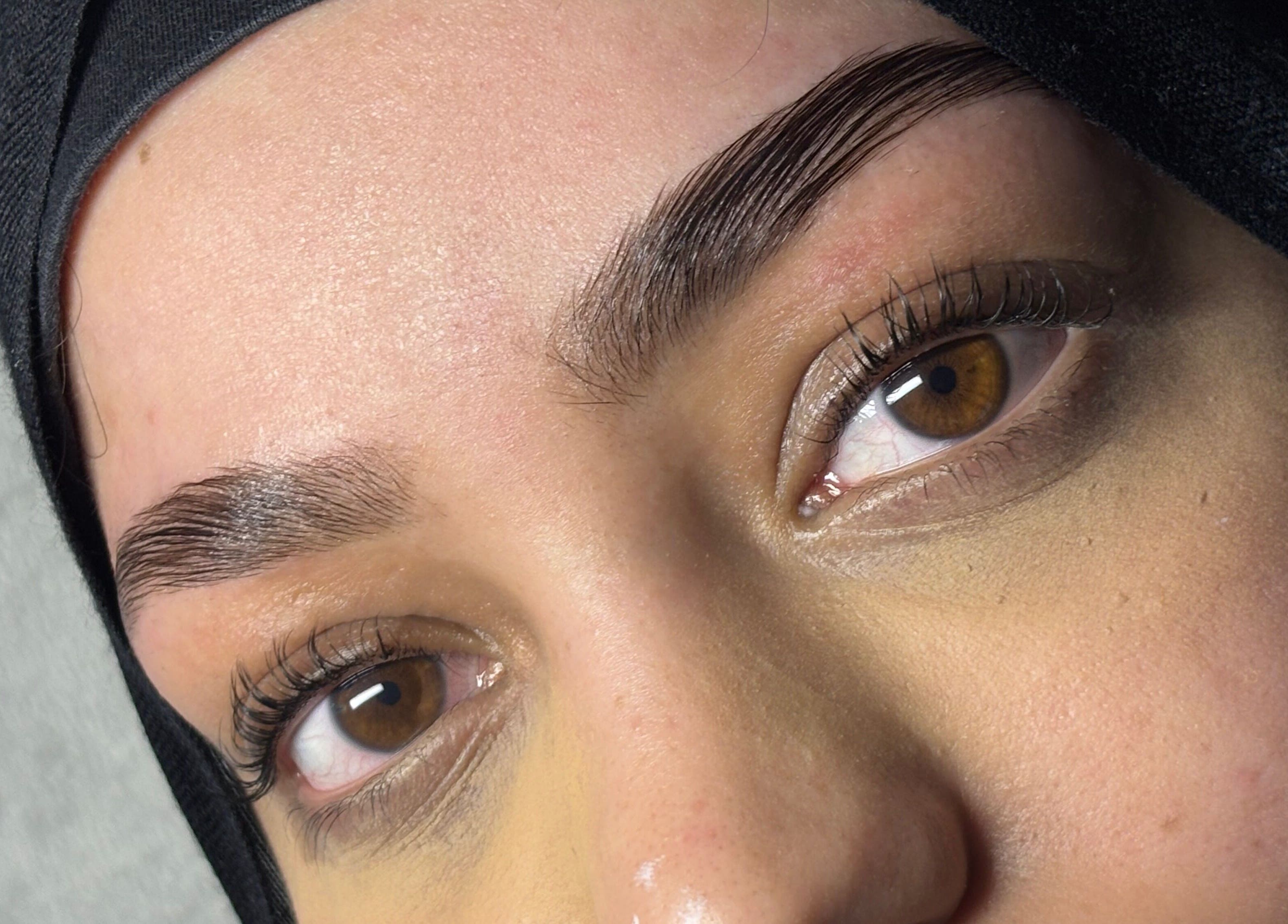 Close-up of expertly shaped eyebrows at Veiled Beauty Bar, Browns Plains, Queensland, AU.
