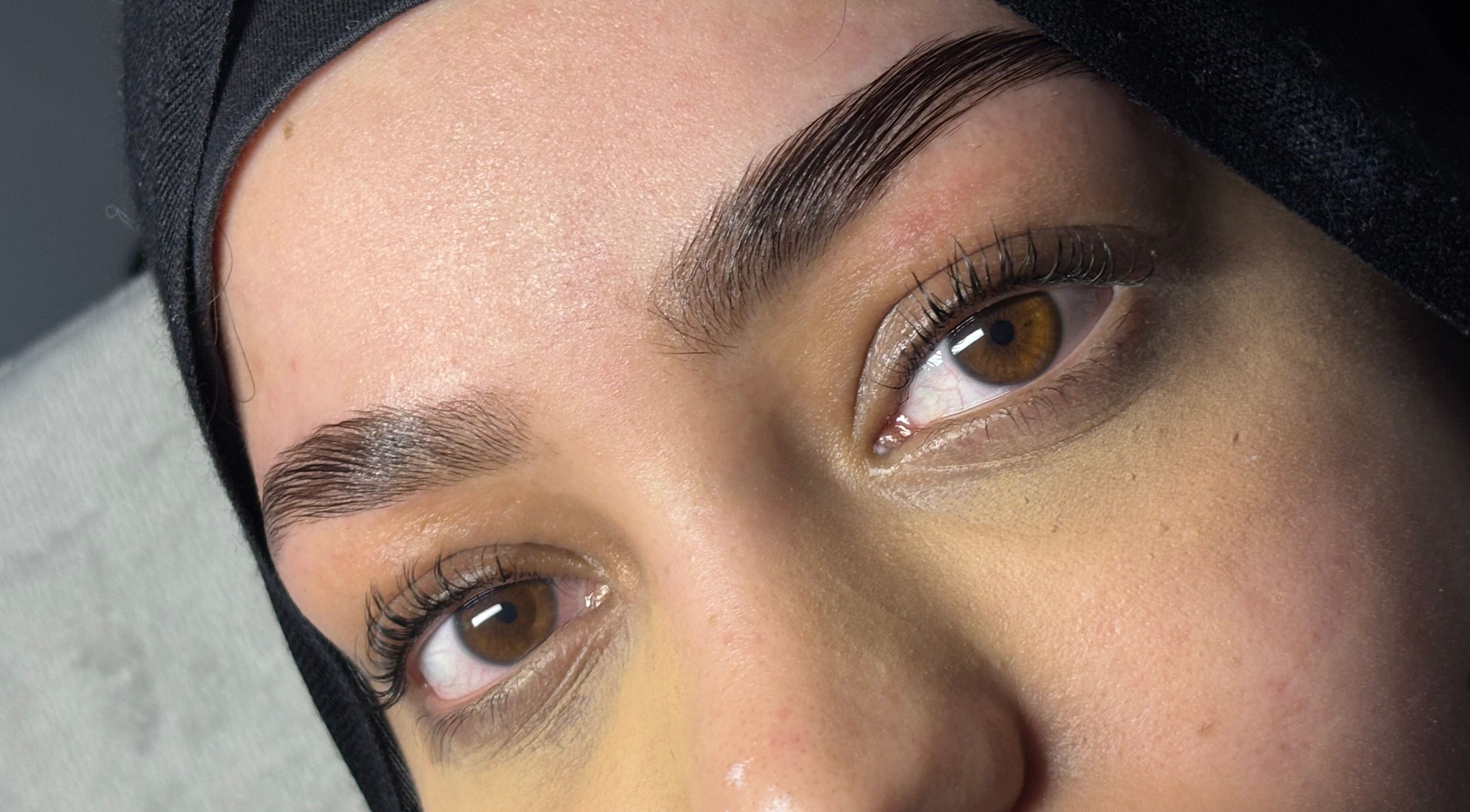 Close-up of expertly shaped eyebrows at Veiled Beauty Bar, Browns Plains, Queensland, AU.