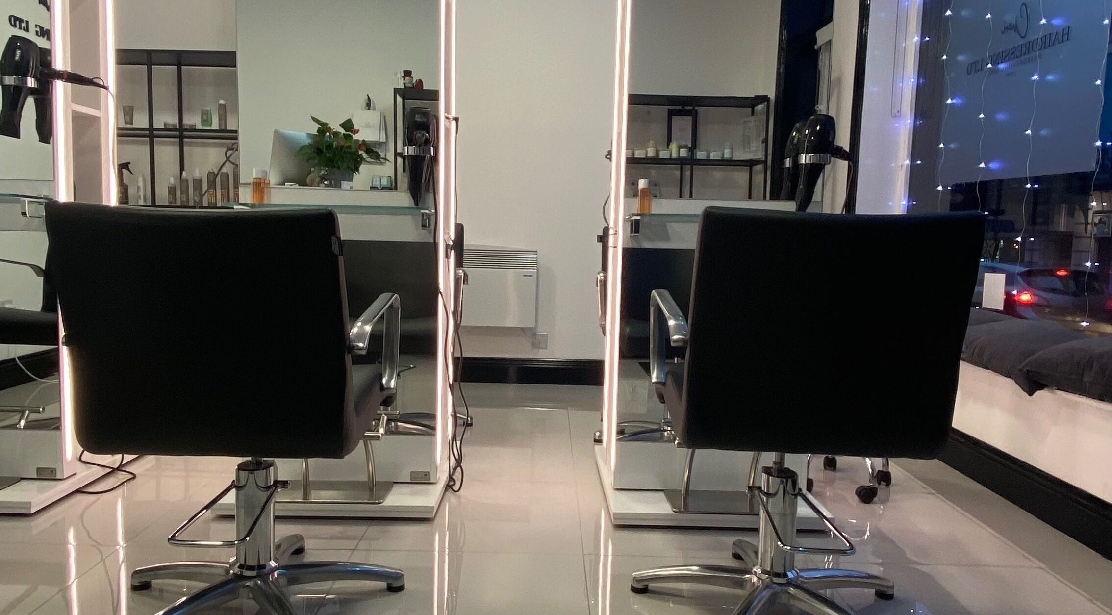 Modern salon chairs and mirrors at Cheri Hairdressing Ltd, Southampton, England, GB.